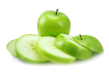Sliced green apple isolated on a white background.