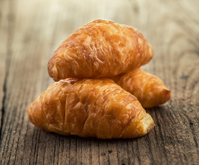 Croissant on wooden table