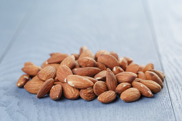 roasted almonds on blue wooden table