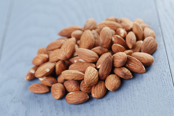 roasted almonds on blue wooden table