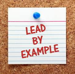 Lead By Example reminder on a cork notice board