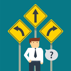 businessman standing in front of three arrows