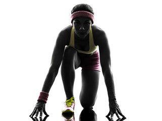 woman runner running on starting blocks silhouette