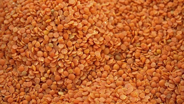 Heap of rotating red lentils (not loopable 4K footage)