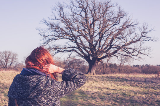 Young Woman Walking The Countryside In Winter