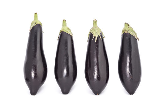Young fresh black eggplants isolated on white
