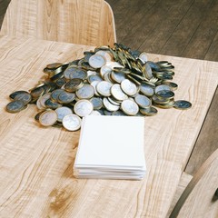 
Huge pile of euro coins and stack of blank papers on table