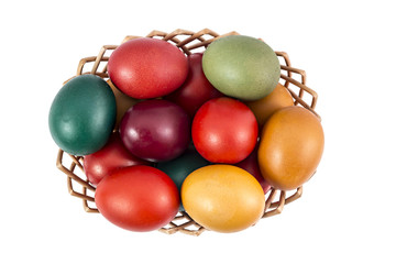 Easter eggs in basket on white background