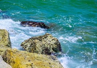 Waves breaking on a stony beach.