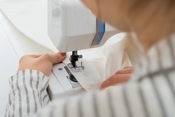 Close-up On Woman Stitching Fabric