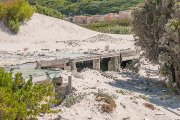 Fototapeta na wymiar Old police station at Hout Bay reclaimed by sand
