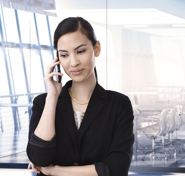 Executive asian businesswoman on the phone
