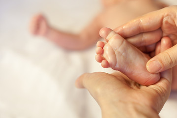 Mother makes massage for happy baby © petunyia