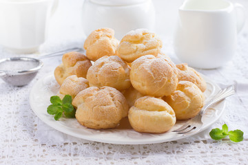 profiteroles with cream and powdered sugar