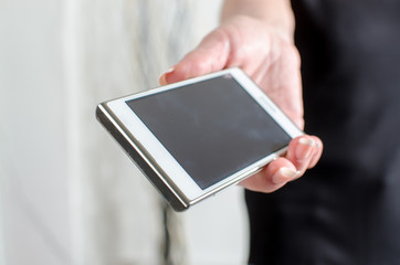 Woman hand holding a smartphone
