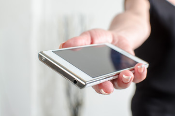 Woman hand holding a smartphone