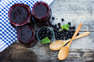 Вlack currant jam on the old table