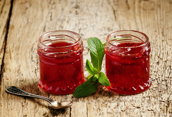 Delicious homemade strawberry jam in a jar, selective focus