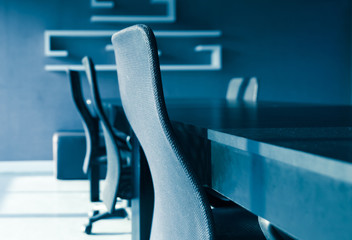 blue tone of  conference table and chairs with sun light in meet