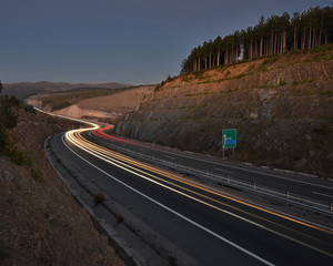 Road passing through mountains.


