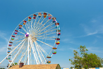 Giant ferris wheel against clear sky at the amusement