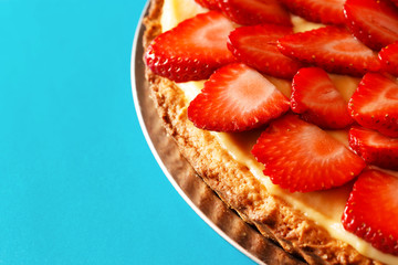 Strawberry tart on blue background