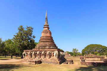 Fototapeta na wymiar Pagoda with elephant sculpture, Wat Sorasak, Shukhothai Historic