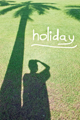 Obraz premium Man and betel palm shadow, Holiday