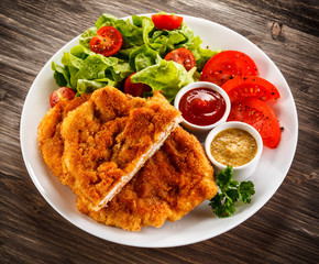 Fried pork chops and vegetable salad 