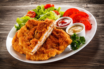 Fried pork chops and vegetable salad 