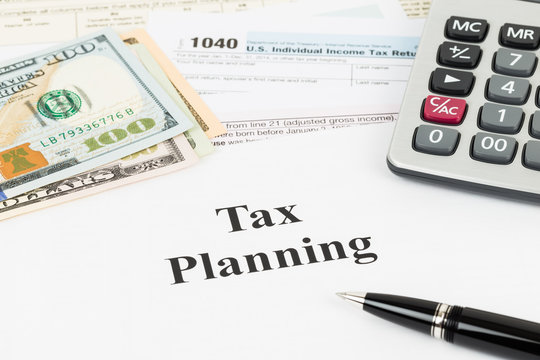 Tax planning wirh calculator and dollar banknote taxation concep
