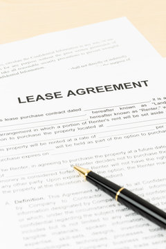 Lease agreement with pen; document is mock-up