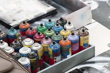 Street artist with spray cans