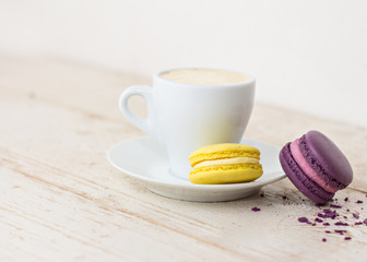 A cup of coffee "espresso" and  macaroon.