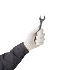 Working hand in glove holding wrench on a white background