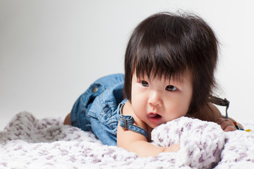 Adorable little baby girl laughing, creeping