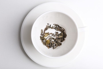 Herbal tea in cup isolate on white