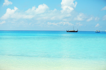 View of beautiful blue ocean water with ship in resort