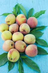 group of fresh peaches on wood background