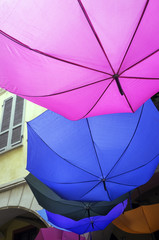 Decorative colorful umbrellas in a country fair. Color image