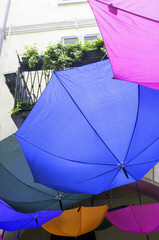 Decorative colorful umbrellas in a country fair. Color image