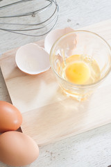 ingredients and tools to make a cake, eggs, bakery cups