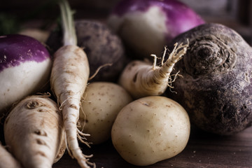 root vegetables from the garden on a brown background