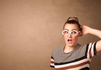Fototapeta premium Portrait of a young pretty woman with sunglasses and copyspace