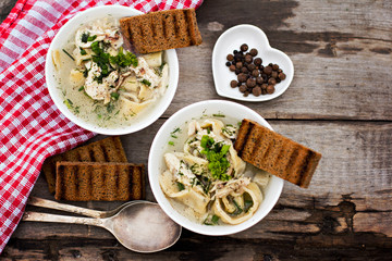 Homemade spaghetti, pasta or noodles on wooden table. 
