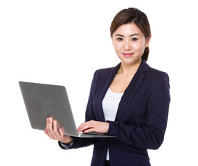 Young businesswoman use of notebook