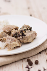 Stew with thyme on plate