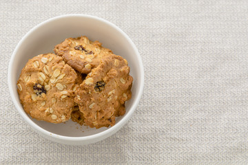 Cookies, cereals in white bowl