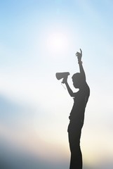 Man with a megaphone, the silhouette. with Lens Flare