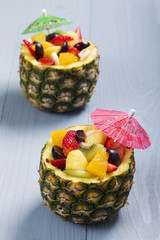 Fresh fruit salad served in bowls with fresh pineapple